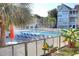 Refreshing pool area with lounge chairs and surrounding greenery at 351 Lake Arrowhead Rd. # 4-315, Myrtle Beach, SC 29572