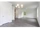 Open dining room with hardwood floors and chandelier at 3327 Moss Bridge Ln., Myrtle Beach, SC 29579