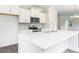 Modern kitchen island with white cabinets and quartz countertops at 3327 Moss Bridge Ln., Myrtle Beach, SC 29579