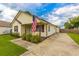 House exterior with American flag and driveway at 8089 Bark Ct., Murrells Inlet, SC 29576