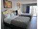 Bedroom with two double beds and ocean view at 1207 S Ocean Blvd. # 51404, Myrtle Beach, SC 29577