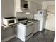 Simple kitchen with microwave, stove, and refrigerator at 1207 S Ocean Blvd. # 51404, Myrtle Beach, SC 29577