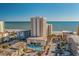 Aerial view of oceanfront property with parking and pool at 1207 S Ocean Blvd. # 51404, Myrtle Beach, SC 29577