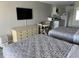 Two twin beds, dresser, TV and small table with chairs in the bedroom at 1207 S Ocean Blvd. # 51404, Myrtle Beach, SC 29577
