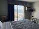 Bedroom with a king bed and ocean view at 1207 S Ocean Blvd. # 51404, Myrtle Beach, SC 29577