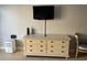 Media center with TV, dresser, and dehumidifier at 1207 S Ocean Blvd. # 50405, Myrtle Beach, SC 29577
