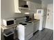 Small kitchen with white appliances and ample cabinet space at 1207 S Ocean Blvd. # 50405, Myrtle Beach, SC 29577