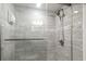 Walk-in shower with gray tile and glass door at 201 74Th Ave. N # 2341, Myrtle Beach, SC 29572