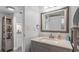 Bathroom with gray vanity and a large mirror at 201 74Th Ave. N # 2341, Myrtle Beach, SC 29572