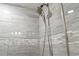 Close up of shower with gray tile and fixtures at 201 74Th Ave. N # 2341, Myrtle Beach, SC 29572
