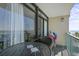 Oceanfront balcony with table and chairs at 201 74Th Ave. N # 2341, Myrtle Beach, SC 29572
