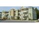 Green apartment building with multiple units and parking at 35 Delray Dr. # 2-C, Murrells Inlet, SC 29576