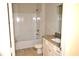 Clean bathroom with tub, toilet, and granite vanity at 35 Delray Dr. # 2-C, Murrells Inlet, SC 29576
