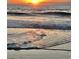 Stunning sunrise over the ocean with gentle waves at 35 Delray Dr. # 2-C, Murrells Inlet, SC 29576
