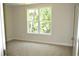 Spacious bedroom featuring a large window and carpeted floor at 35 Delray Dr. # 2-C, Murrells Inlet, SC 29576