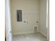 Bright laundry room with tile floor, shelving and hookups at 35 Delray Dr. # 2-C, Murrells Inlet, SC 29576