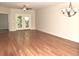 Spacious living room with hardwood floors and access to a balcony at 35 Delray Dr. # 2-C, Murrells Inlet, SC 29576