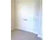 Double-door closet with neutral walls and carpet at 35 Delray Dr. # 2-C, Murrells Inlet, SC 29576