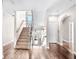 Elegant entryway with hardwood floors and a grand staircase leading to the upper level at 181 Palmetto Harbour Dr., North Myrtle Beach, SC 29582