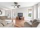 Relaxing living room with hardwood floors, comfortable seating, and water views at 181 Palmetto Harbour Dr., North Myrtle Beach, SC 29582