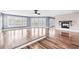 Spacious living area with hardwood floors, fireplace, and multiple windows at 181 Palmetto Harbour Dr., North Myrtle Beach, SC 29582