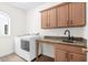 Laundry room with washer, dryer, and granite countertop at 181 Palmetto Harbour Dr., North Myrtle Beach, SC 29582