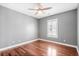 Simple bedroom with hardwood floors and plantation shutters at 181 Palmetto Harbour Dr., North Myrtle Beach, SC 29582