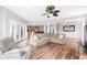 Spacious living room features hardwood floors, a comfortable sectional sofa, and access to a deck at 181 Palmetto Harbour Dr., North Myrtle Beach, SC 29582