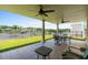 Covered patio overlooking the water with seating for four at 181 Palmetto Harbour Dr., North Myrtle Beach, SC 29582