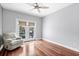 Bedroom with hardwood floors, French doors, and a comfy chair at 181 Palmetto Harbour Dr., North Myrtle Beach, SC 29582