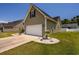 Exterior view of house showcasing garage and landscaping at 521 Tourmaline Dr., Little River, SC 29566