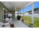 Relaxing screened porch with grill and seating area at 521 Tourmaline Dr., Little River, SC 29566