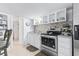 White kitchen with stainless steel appliances and gray countertops at 6001 - 1193A S Kings Hwy., Myrtle Beach, SC 29575
