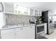 Modern kitchen with stainless steel appliances and a tile backsplash at 6001 - 1193A S Kings Hwy., Myrtle Beach, SC 29575