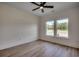 Bright bedroom with wood flooring and ceiling fan at 205 Brush Ct., Little River, SC 29566