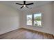 Bright bedroom with wood flooring and ceiling fan at 205 Brush Ct., Little River, SC 29566