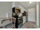 Small kitchen with a small table and chairs at 1205 S Ocean Blvd. # 50605, Myrtle Beach, SC 29577