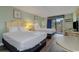 Two double beds, a small table, and access to a balcony at 1205 S Ocean Blvd. # 50605, Myrtle Beach, SC 29577