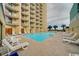 Inviting outdoor pool with plenty of lounge chairs at 1205 S Ocean Blvd. # 50605, Myrtle Beach, SC 29577