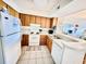 Well-equipped kitchen featuring wood cabinets and modern appliances at 207 N Ocean Blvd. # 242, North Myrtle Beach, SC 29582
