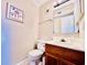 Small half bathroom with patterned wallpaper at 207 N Ocean Blvd. # 242, North Myrtle Beach, SC 29582