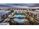 Aerial view of complex with pool, tennis courts, and landscaping at 207 N Ocean Blvd. # 242, North Myrtle Beach, SC 29582