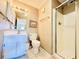 Clean bathroom with shower, toilet and vanity with storage at 207 N Ocean Blvd. # 242, North Myrtle Beach, SC 29582