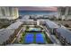 Aerial view of complex with pool, tennis courts, and ocean view at 207 N Ocean Blvd. # 242, North Myrtle Beach, SC 29582