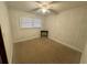 Simple bedroom with neutral walls and ceiling fan at 1763 St. James Rd., Hemingway, SC 29554