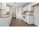 Updated kitchen with white cabinets, granite countertops, and modern appliances at 2183 Highway 544, Conway, SC 29526