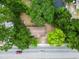 House nestled amongst lush green trees, situated near a busy road at 2183 Highway 544, Conway, SC 29526