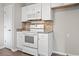 White kitchen cabinets and appliances, including a microwave and oven at 2183 Highway 544, Conway, SC 29526