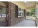 Brick home with a burgundy front door and shutters at 2183 Highway 544, Conway, SC 29526