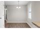 Simple dining area with wood floors and a light fixture at 2183 Highway 544, Conway, SC 29526